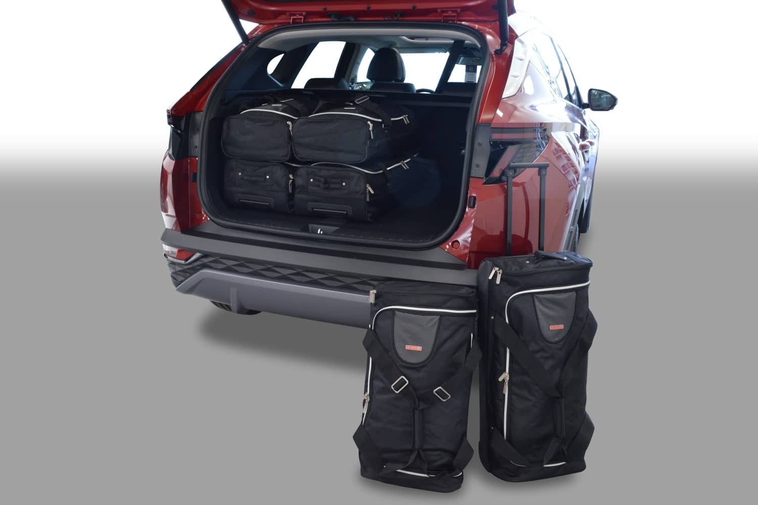 h11401s-hyundai-tucson-nx4-2020-car-bags-1.jpg Reistassenset geschikt voor Hyundai Tucson (NX4) 2020-heden Original - Afbeelding 1
