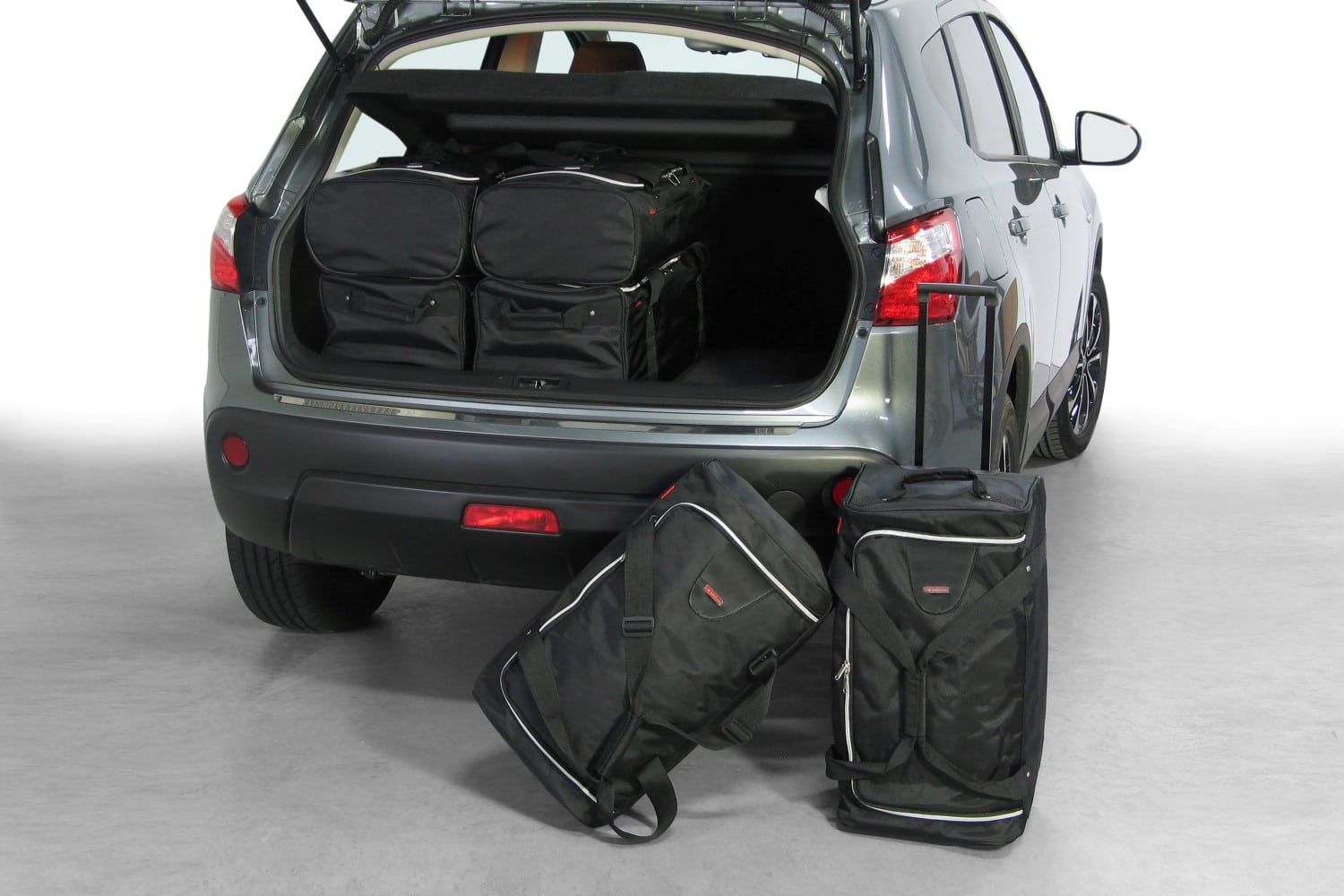 n10101s-nissan-qashqai-07-14-car-bags-1.jpg Reistassenset geschikt voor Nissan Qashqai (J10) 2007-2013 Original - Afbeelding 1